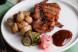 Отбивная из свинины с молодым картофелем, маринованным луком с соусом BBQ