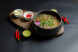Pho Bo with beef and rice noodles, soy sprouts, and red onions
