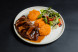 Beef steak with mashed sweet potatoes, oyster sauce, and vegetable salad