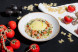 Птитим с мясом краба, красной икрой, пармезаном и голландским соусом